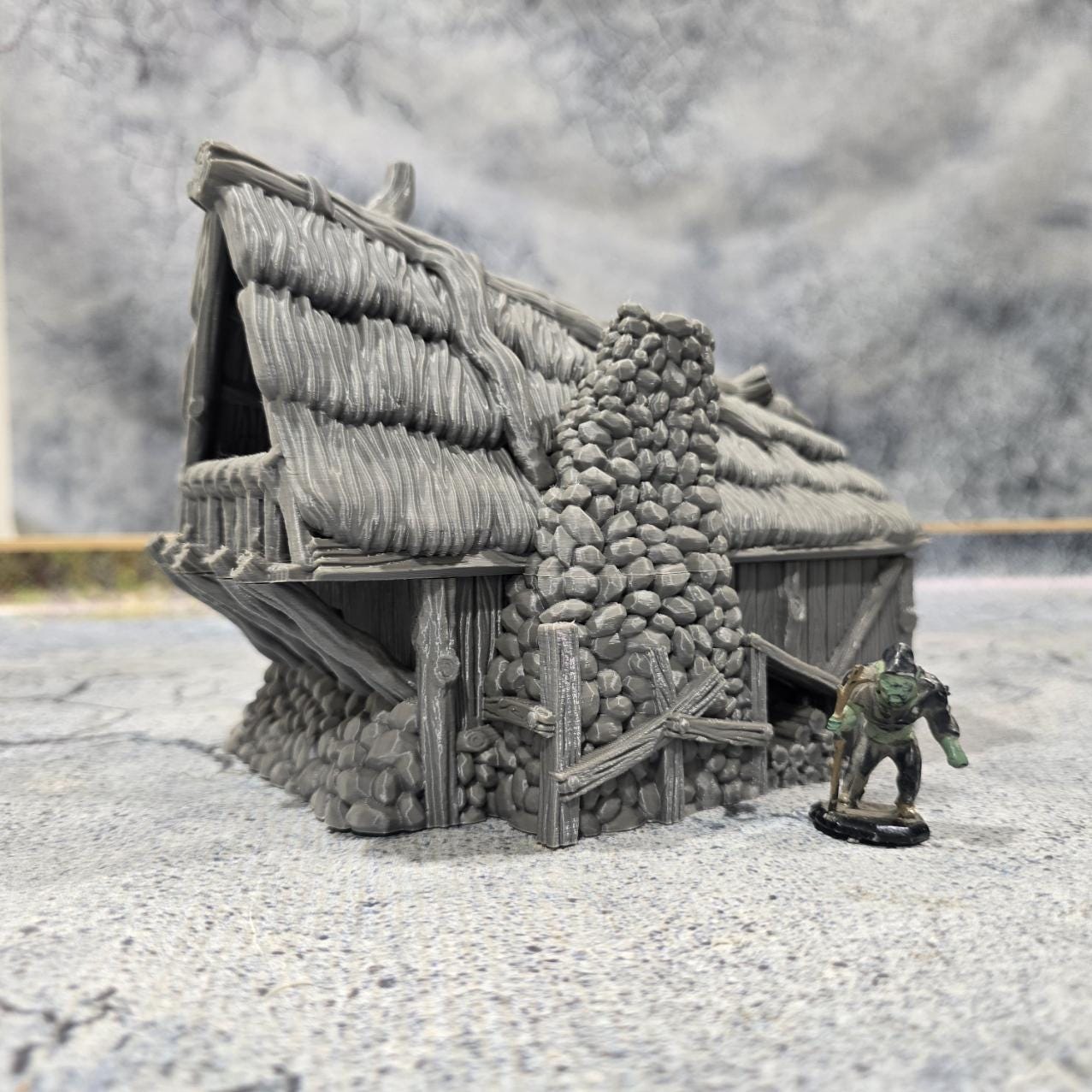Discover the Achievement Building, Medieval Nordic Lodge, expertly designed for historical and fantasy settings, showcasing fine craftsmanship and an authentic look suitable for various tabletop games.