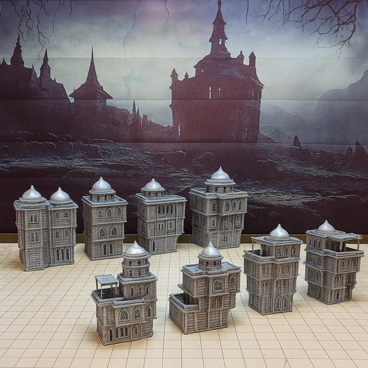 A desert skyline of domes and stonework rises on the tabletop—eight playable buildings crafted for immersive urban skirmishes and narrative-rich adventures. Removable rooftops, arched windows, and stackable floors make this the ultimate Eastern city terrain bundle.