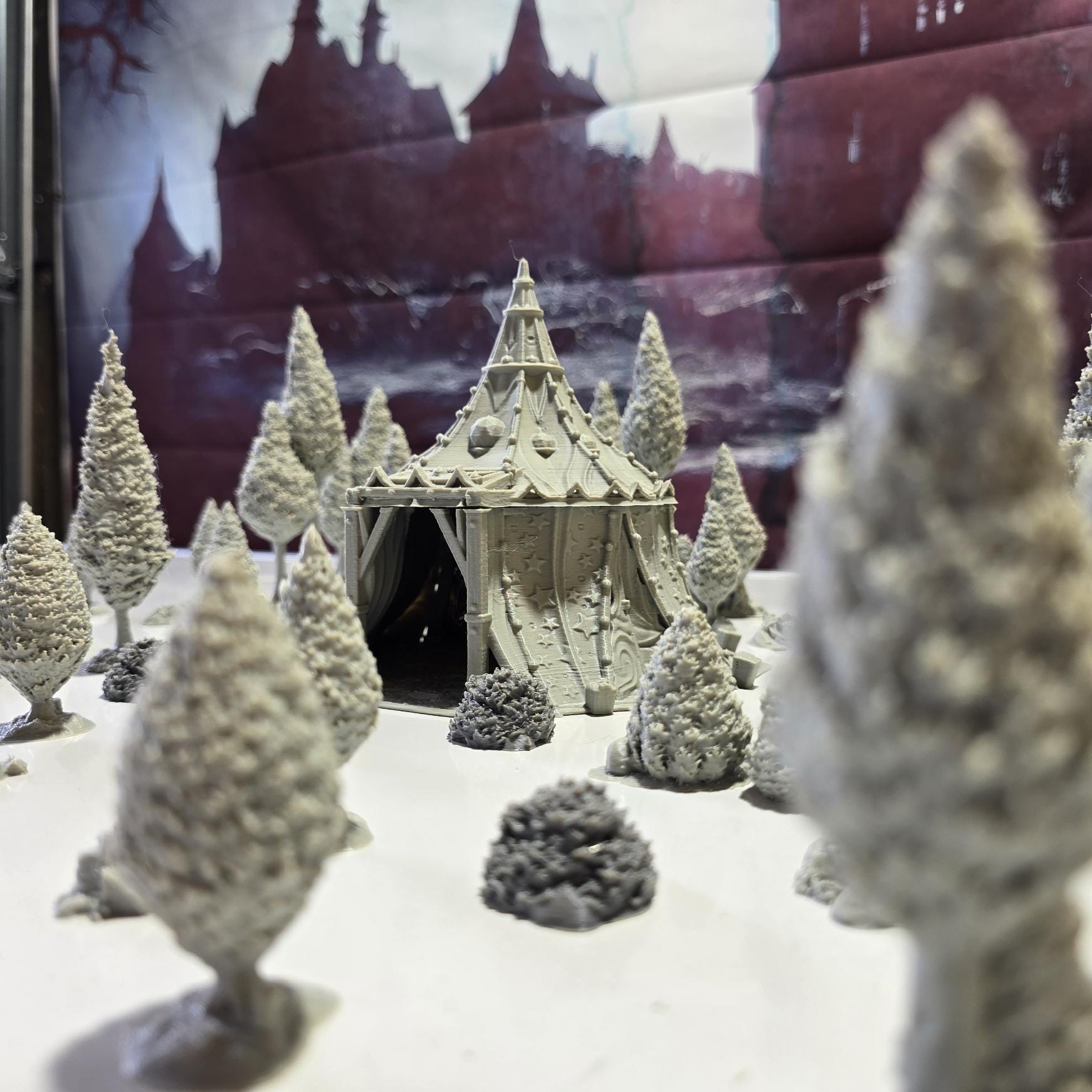 A star-patterned medieval fantasy tent glows with an otherworldly light, its interior revealing a robed fortune teller poised behind a crystal ball. The sweeping fabric walls and tall spire create an aura of mystery, perfect for a marketplace encounter, a festival scene, or a secret meeting in your next tabletop adventure.