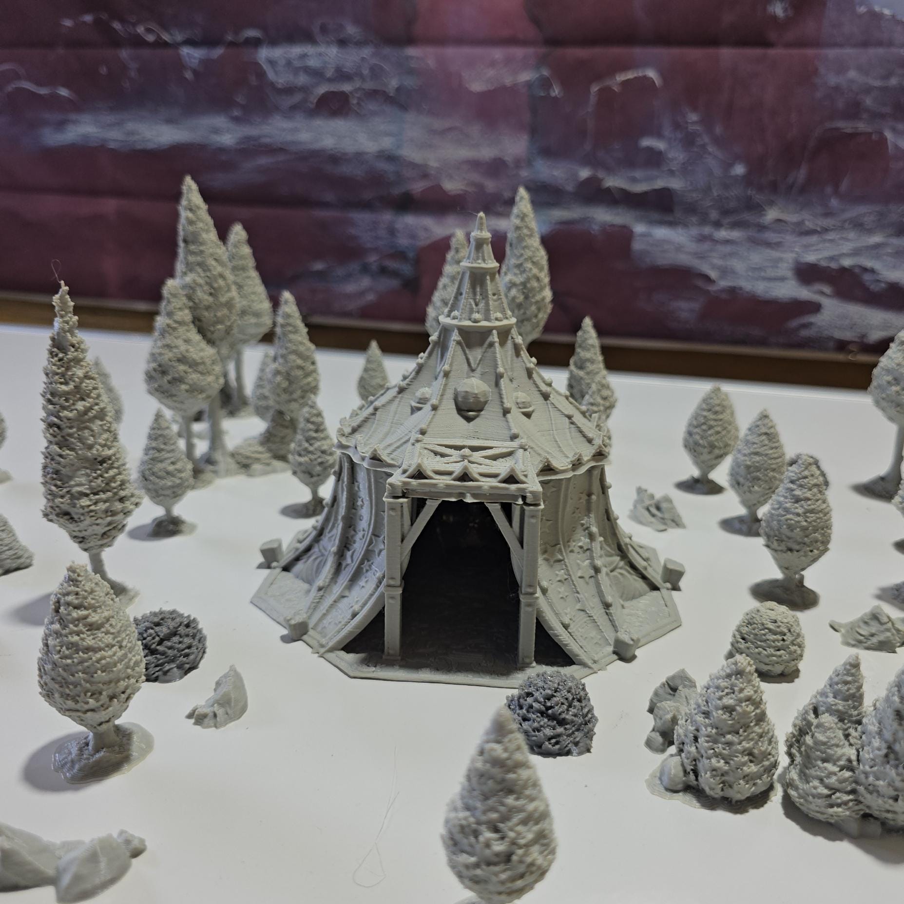 A star-patterned medieval fantasy tent glows with an otherworldly light, its interior revealing a robed fortune teller poised behind a crystal ball. The sweeping fabric walls and tall spire create an aura of mystery, perfect for a marketplace encounter, a festival scene, or a secret meeting in your next tabletop adventure.