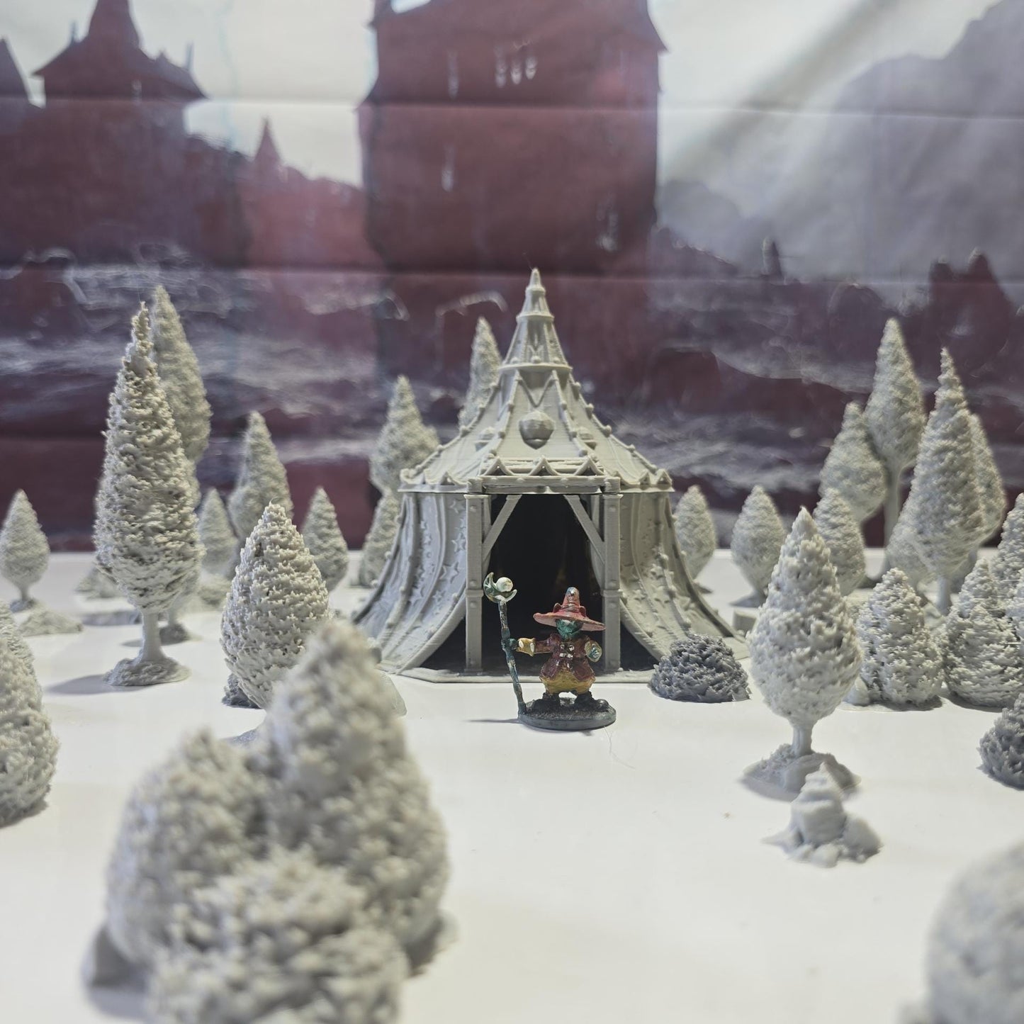 A star-patterned medieval fantasy tent glows with an otherworldly light, its interior revealing a robed fortune teller poised behind a crystal ball. The sweeping fabric walls and tall spire create an aura of mystery, perfect for a marketplace encounter, a festival scene, or a secret meeting in your next tabletop adventure.