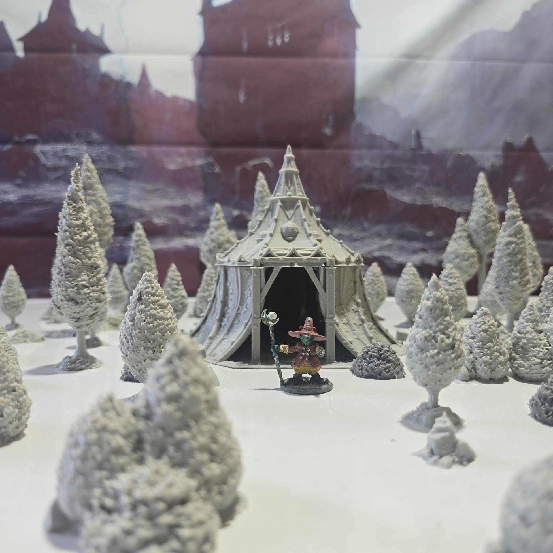 A star-patterned medieval fantasy tent glows with an otherworldly light, its interior revealing a robed fortune teller poised behind a crystal ball. The sweeping fabric walls and tall spire create an aura of mystery, perfect for a marketplace encounter, a festival scene, or a secret meeting in your next tabletop adventure.
