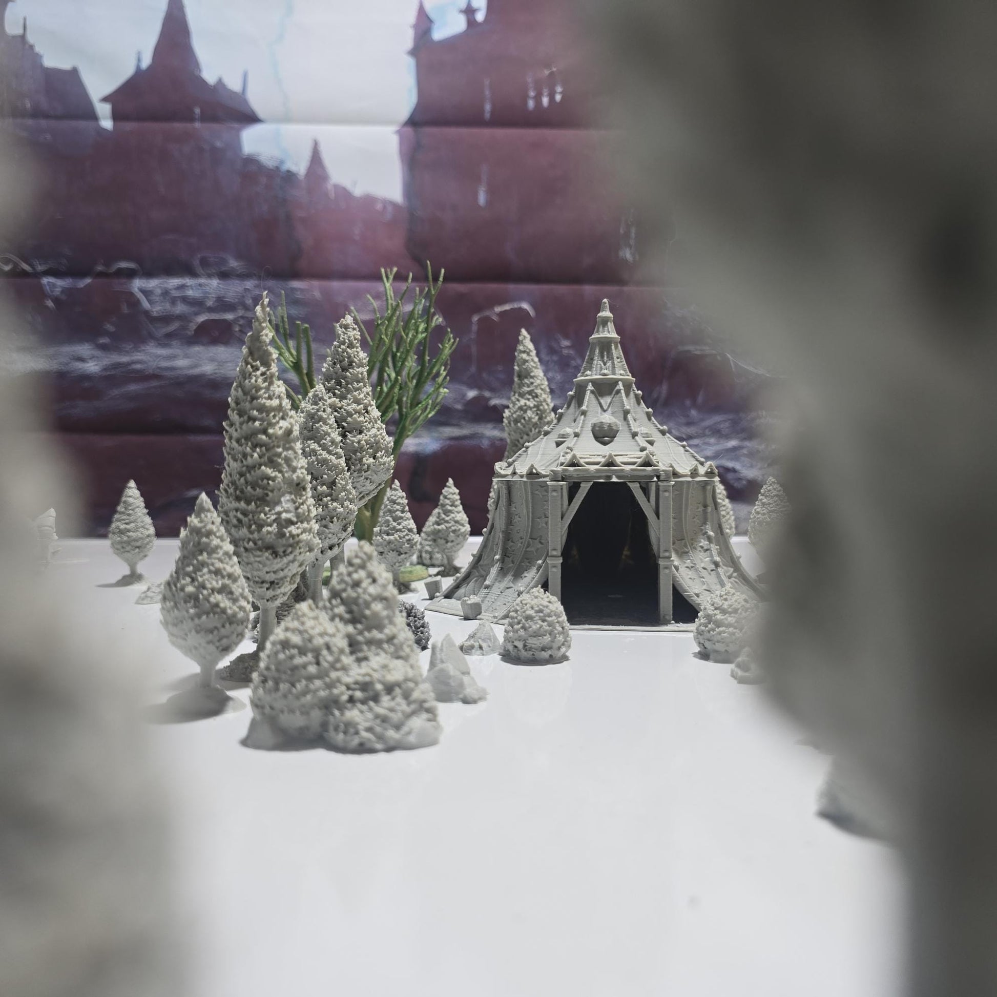 A star-patterned medieval fantasy tent glows with an otherworldly light, its interior revealing a robed fortune teller poised behind a crystal ball. The sweeping fabric walls and tall spire create an aura of mystery, perfect for a marketplace encounter, a festival scene, or a secret meeting in your next tabletop adventure.