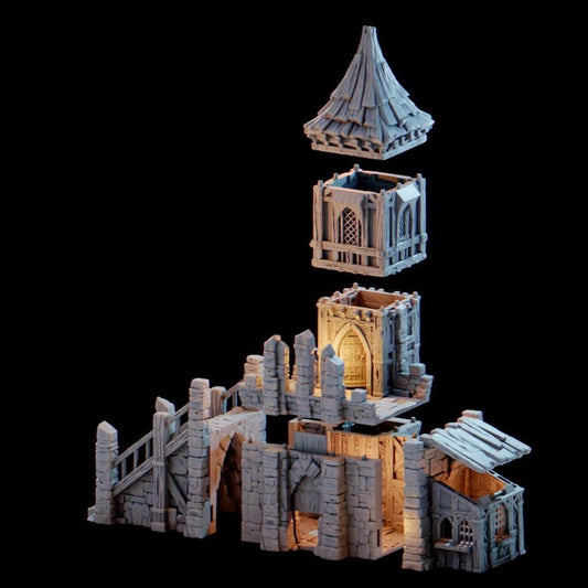 The Tinker Shop & Town Jail rises in stone and timber, its tower climbing high above the battlements. A fortified gatehouse hides barred cells below, while the upper levels reveal a craftsman’s workshop brimming with mechanical detail. The removable roof and stacked floors open the structure for skirmishes, jailbreaks, and daring rooftop showdowns.