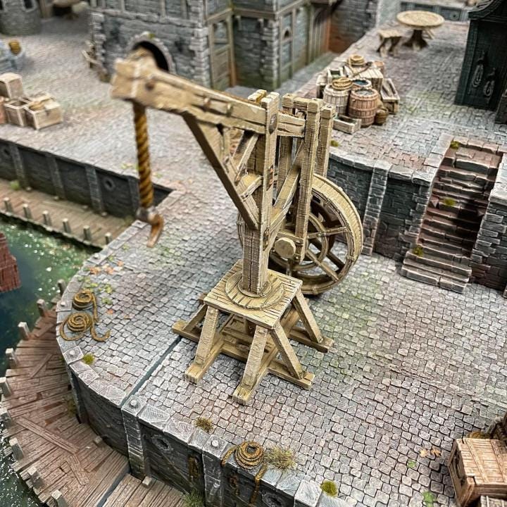 The Threadwheel Crane stands tall on the docks of Ancrabourg, its massive wooden wheel ready to lift barrels, crates, and treasure from the harbor. A working landmark of trade, labor, and adventure.