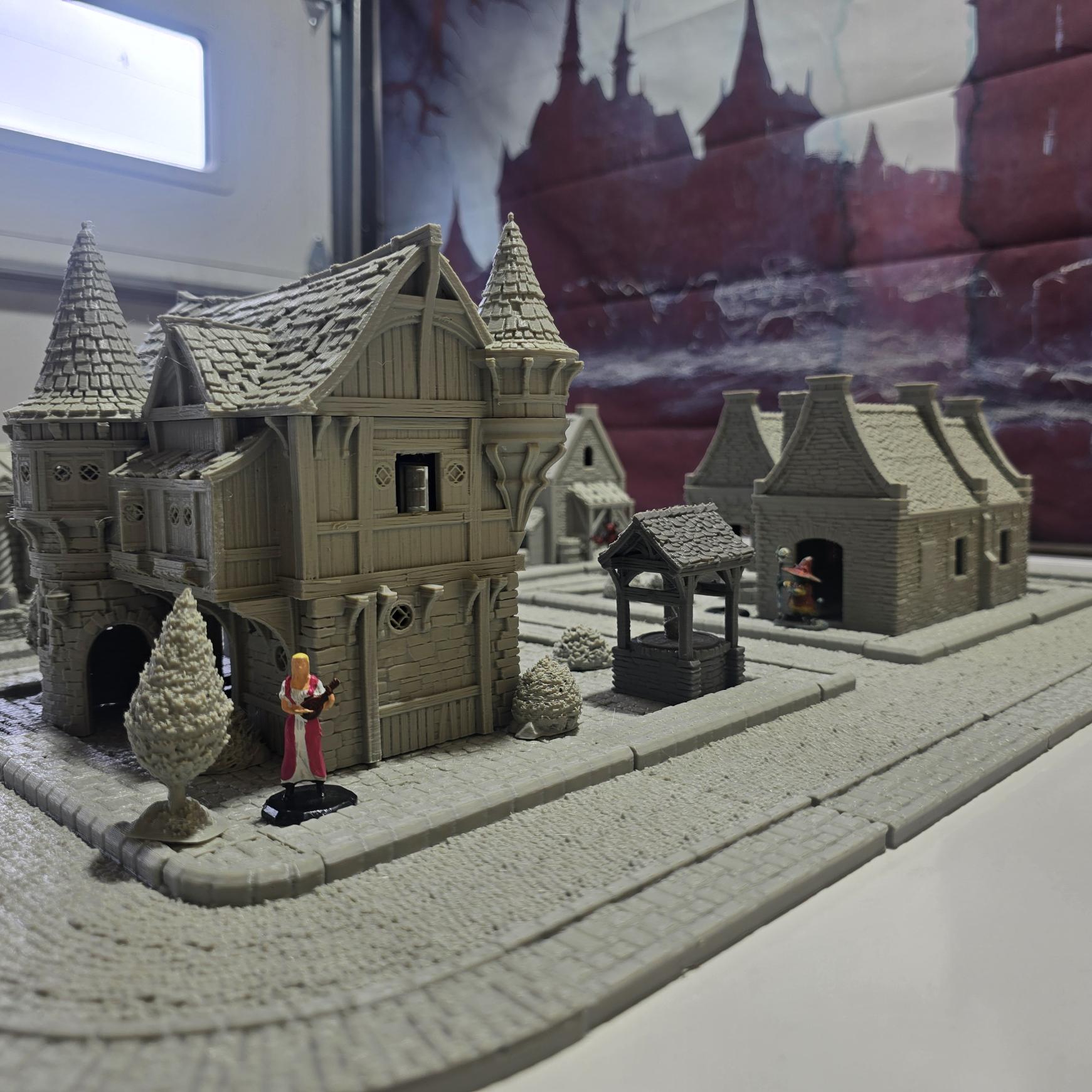 Step into the Greendale Colonial Village, a fully playable 28mm tabletop town. With cobblestone streets, detailed scatter, and four unique starter blocks, this set is ready for storytelling straight out of the box — and fully expandable with 25+ future buildings, a castle, and fortifications.