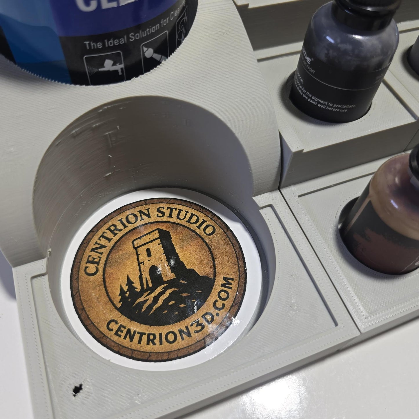 Miniature painting workspace with modular gray PLA trays